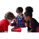 A group of three children engaged in a fun game of Double Shutter by Blue Orange U.S.A. They are intently focusing on the game pieces inside a red box labeled 'DOUBLE SHUTTER'. The children, two boys and a girl, display excitement and teamwork as they play together.