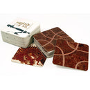 A set of Tsuro game tiles from Calliope, featuring beautiful designs including a dragon and intricate pattern. The tiles are stacked and displayed at an angle, showcasing their glossy finish and artistic illustrations. The game focuses on strategy and path creation.