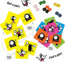 The PAIRZI game by Tenzi features colorful cards with playful monster characters. The vibrant cards are scattered across a surface, with dice and mini game pieces nearby. Some cards show matching pairs, highlighted by arrows and text prompts to 'Roll a pair!' and 'Find a pair!' This engaging game encourages quick matching and social interaction for players of all ages.