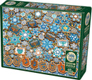 Cobble Hill Hanukkah Cookies jigsaw puzzle with 1000 pieces, featuring an array of beautifully decorated cookies shaped like stars, dreidels, and menorahs, in festive blue and gold colors. The puzzle box showcases an appealing design perfect for holiday-themed family activities.