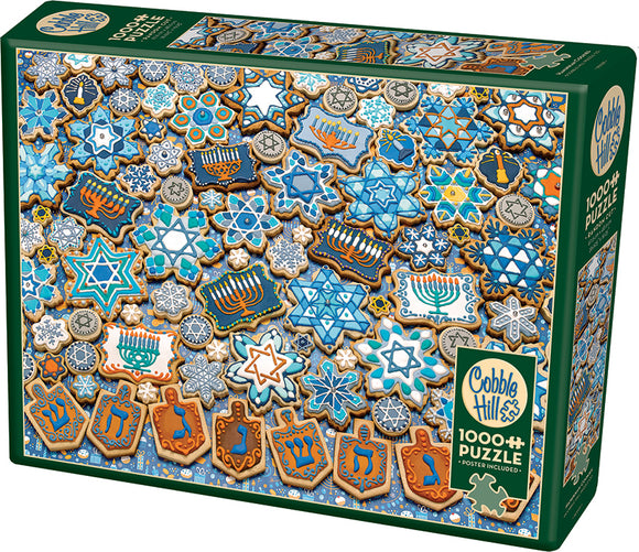 Cobble Hill Hanukkah Cookies jigsaw puzzle with 1000 pieces, featuring an array of beautifully decorated cookies shaped like stars, dreidels, and menorahs, in festive blue and gold colors. The puzzle box showcases an appealing design perfect for holiday-themed family activities.