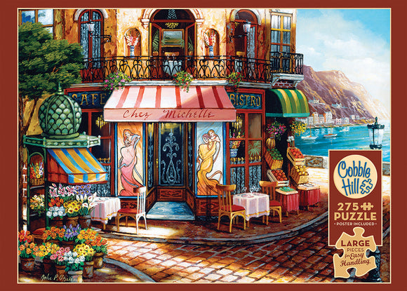 A colorful jigsaw puzzle titled 'Chez Michelle' by Cobble Hill, depicting a charming bistro scene. The artwork features vibrant flowers, outdoor seating, and picturesque buildings with a backdrop of mountains and a waterfront, ideal for puzzle lovers seeking a relaxing challenge. Contains 275 large pieces for easy handling, and a poster is included.