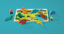Colorful wooden jigsaw puzzle featuring various dinosaurs set on a vibrant scene with a volcano, plants, and water. Includes seven dinosaur figures and additional themed pieces, ideal for imaginative play.