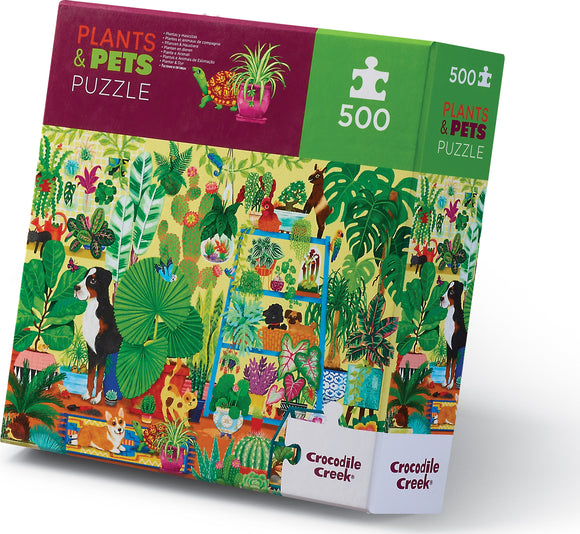 The Plants & Pets 500-piece jigsaw puzzle by Crocodile Creek features a vibrant illustration of various plants and playful pets in a lush garden setting. The puzzle box showcases colorful artwork with animals like dogs and adorable cats among a variety of greenery, appealing for both nature and animal lovers.