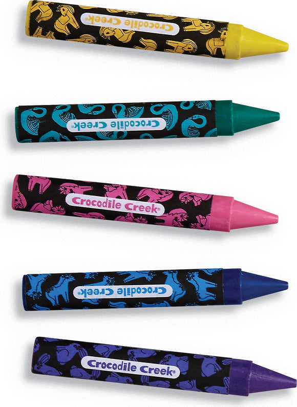 A set of five coloring crayons featuring vibrant colors. Each crayon has a fun, animal-themed design on its wrapper, showcasing a unicorn, elephant, and other playful patterns. The colors include yellow, turquoise, pink, green, and blue. The product is made by Crocodile Creek.
