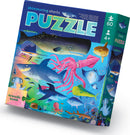 Shimmering Sharks Foil Puzzle box featuring vibrant ocean life including various sharks, an octopus, and a whale, with the title prominently displayed. Ideal for kids aged 4 and up.