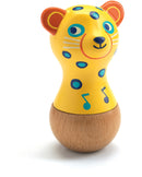 A colorful maracas shaped like a jaguar, featuring a bright yellow body adorned with blue spots and musical notes, with a wooden base. Ideal for children, this joyful instrument encourages musical exploration and sensory development.