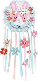 Colorful DIY kit featuring Dreamer Dreamcatcher by DJECO. The kit showcases a playful design with a pink bunny face adorned with flowers, ribbons, and birds intricately hanging below, encouraging creativity and imagination.
