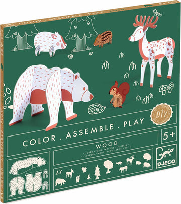 DJeco's DIY kit titled 'Woods - Color. Assemble. Play.' featuring wooden animal figures including bears, a deer, a squirrel, and a hedgehog. The colorful illustrations and forest-themed design promote creativity and imaginative play for ages 5 and up. Includes 13 pieces for assembly.