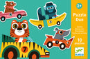 A colorful jigsaw puzzle titled 'Racing Cars Puzzle Duo' featuring cute cartoon animals driving various colorful racing cars, designed for kids aged 2 and up. The puzzle contains 10 pieces in a vibrant design, showcasing a bear in a pink car, a tiger in a striped car, a monkey in a yellow boat car, and a dog in a red racing car, all set against a bright green background.