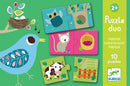The Habitat Puzzle Duo by DJECO features colorful jigsaw puzzle pieces including a cheerful blue bird, a playful cat, a green cow, and a basket. Designed for children ages 2 and up, this engaging set contains 10 puzzle pairs that help improve cognitive skills and hand-eye coordination. The bright, appealing illustrations enhance visual learning.