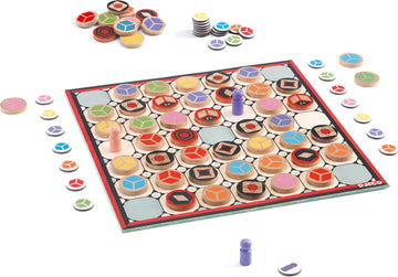 Twisty game by Djeco featuring a colorful board with various geometric shapes and wooden pieces. The game is laid out with vibrant tokens and player pieces on the board, promoting strategic play and fun for kids and families.
