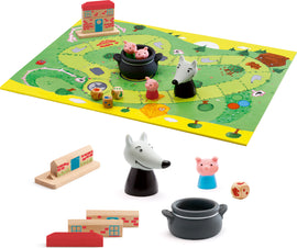 Woolfy Family Game by DJECO featuring a colorful game board with whimsical illustrations of animals and houses, character figurines including pigs and a wolf, and various game pieces like dice and wooden blocks arranged around the board. The playful design is perfect for family fun and involves strategy and teamwork.
