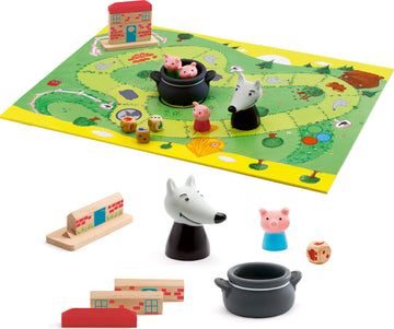 Woolfy Family Game by DJECO featuring a colorful game board with whimsical illustrations of animals and houses, character figurines including pigs and a wolf, and various game pieces like dice and wooden blocks arranged around the board. The playful design is perfect for family fun and involves strategy and teamwork.