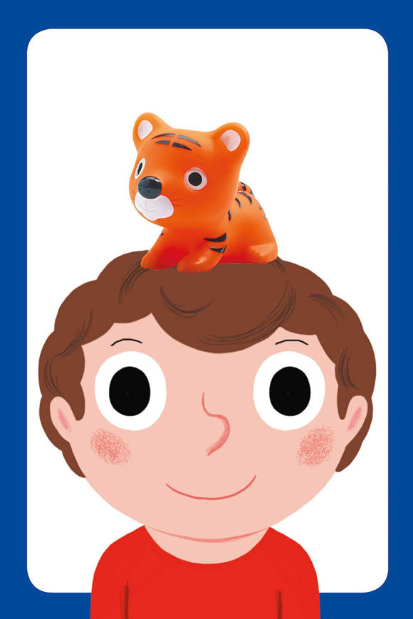 The Little Action Little Game by DJECO features a playful design with a smiling young boy and an adorable orange tiger figure perched on his head. This engaging game is perfect for sparking imagination and creativity in children, inviting them to participate in fun activities.