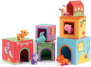 Colorful stacking blocks featuring animal figurines. Each block has an opening with a different animal toy peeking out. The blocks are decorated with vibrant patterns, depicting playful scenes and numbers. Ideal for imaginative play and developing fine motor skills.