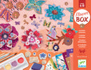 The Flower Garden Multi-Activity Craft Kit by Djeco features vibrant and colorful components, including decorative flowers, butterfly stamps, and art supplies designed for children aged 6-10 to explore their creativity through DIY projects. The kit promotes imaginative play, encouraging kids to create unique floral designs and mixed media art.