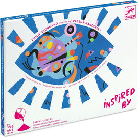The DJECO Abstract Colored Sands kit features a colorful and artistic box designed with abstract patterns, reminiscent of Wassily Kandinsky's style. It displays bright blue, pink, and orange elements over a white background, encouraging creativity and artistic expression through colored sands. Ideal for children, this DIY kit invites imaginative play.
