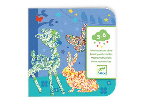 The Colorful Parade Marble Painting Kit by DJECO features a vibrant design with deer, rabbits, and butterflies. This DIY kit is ideal for children aged 3-6, encouraging creative artistic expression using marbles to create colorful patterns.