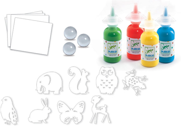 Colorful Parade Marble Painting Kit by DJECO featuring vibrant paint bottles in green, red, yellow, and blue. The kit includes clear marbles, sheets of white paper, and playful animal-shaped stencils of an elephant, squirrel, owl, frog, butterfly, deer, rabbit, and bird, designed for creative DIY marble painting projects.