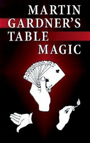 Cover of Martin Gardner's Table Magic, featuring an image of hands displaying a fan of playing cards and performing a magic trick with a lit match. The background is predominantly black with red accents, highlighting the title in bold white letters.