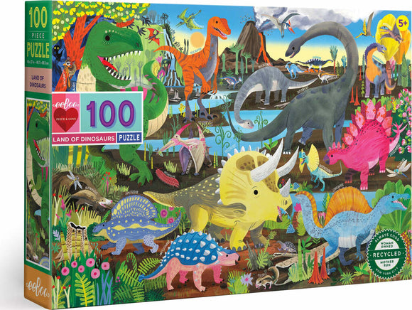 Eeboo's Land of the Dinosaurs jigsaw puzzle featuring 100 colorful pieces showcasing various dinosaurs in a vibrant prehistoric landscape. The puzzle highlights a variety of dinosaur species surrounded by lush vegetation, water, and a bright sky, making it an engaging and educational activity for children 5 years and up.