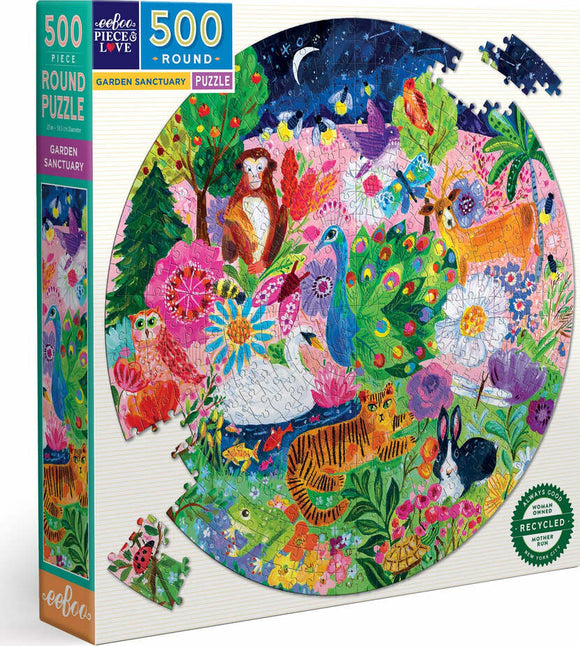 The Garden Sanctuary jigsaw puzzle by Eeboo features a vibrant, whimsical scene of a serene garden filled with various animals including a peacock, monkeys, and deer among colorful flowers. This round puzzle has 500 pieces and comes in eco-friendly packaging, highlighting its recycled materials. It's an ideal choice for nature lovers and puzzle enthusiasts.