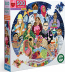 A vibrant 500-piece round jigsaw puzzle titled 'International Women's Day' by Eeboo. The puzzle features diverse women from various professions and cultures, surrounded by symbols of empowerment and community, celebrating women's contributions to society.