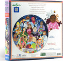 A vibrant and colorful 500-piece round jigsaw puzzle titled 'International Women's Day' by Eeboo. The design features a diverse group of women representing various professions and cultures, showcasing strength and unity. The puzzle design includes elements such as fruit, a medical scene, and artistic motifs, highlighting women's contributions throughout history. The box displays the puzzle's diameter of 23 inches (58.5 cm) and a message that celebrates women's achievements.