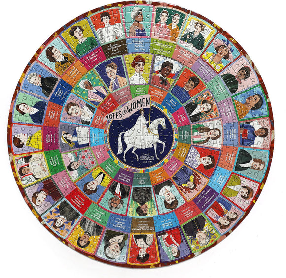 A circular jigsaw puzzle titled 'Votes for Women' by Eeboo. The puzzle features portraits of historical women who fought for suffrage, arranged in colorful segments around a central image of a woman on a unicorn. Each segment displays a portrait along with a name or quote, celebrating key figures in the women's rights movement.