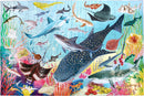 Colorful jigsaw puzzle titled 'Love of Sharks' featuring various marine animals including sharks, rays, and colorful coral reefs. The puzzle depicts a vibrant underwater scene with intricate details of different fish species swimming among the coral.
