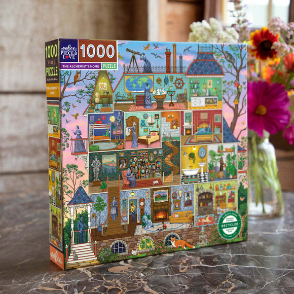 A brightly illustrated jigsaw puzzle box titled 'The Alchemist's Home' by Eeboo. The box displays various rooms and elements related to alchemy, including laboratories, books, plants, and figures engaged in scientific exploration. The design features vibrant colors and intricate details, making it visually engaging for puzzle enthusiasts.