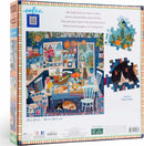 Eeboo Blue Kitchen Jigsaw Puzzle featuring a vibrant illustration of a cozy kitchen, filled with colorful fruits, plants, and cats lounging on the floor. The puzzle consists of 1000 pieces and showcases a warm, inviting culinary space. The box includes an image of the puzzle and highlights actual piece sizes.