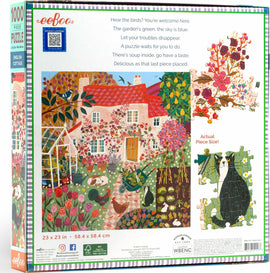 Eeboo's English Cottage jigsaw puzzle featuring a colorful illustration of a charming cottage surrounded by a vibrant garden with flowers, animals, and a greenhouse. The puzzle consists of 1000 pieces and includes a sample image of actual puzzle pieces. The dimensions are 23 x 23 inches (58.4 x 58.4 cm). The back of the box contains a whimsical poem about the garden and the puzzle experience.