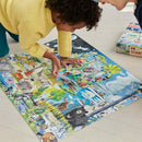 A child in a yellow sweater is focused on assembling a colorful jigsaw puzzle titled 'Within the Biome.' The puzzle features a vibrant depiction of various animals and nature scenes, showcasing a playful and educational design. A puzzle box is visible in the background, indicating it contains 48 large pieces.
