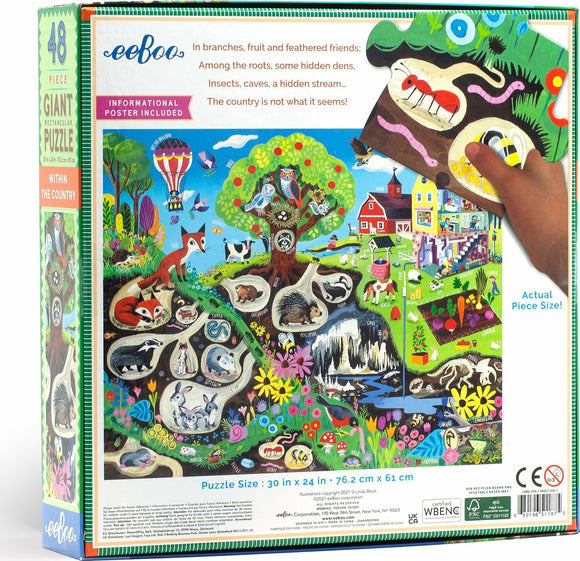 Eeboo Within the Country 48-piece giant jigsaw puzzle featuring a colorful illustration of rural scenes with various animals and nature elements. A hand is shown placing a puzzle piece. Includes an informational poster. The puzzle measures 30 x 24 inches, perfect for family fun and educational play.