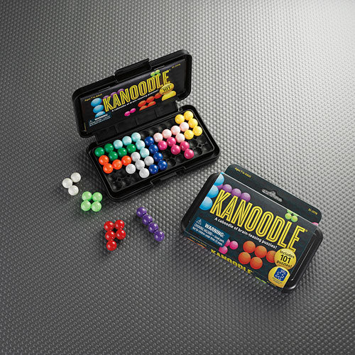Kanoodle by Educational Insights is a mechanical puzzle game featuring a variety of colorful pieces organized in a compact case. The game includes a challenge booklet, perfect for enhancing problem-solving skills and encouraging logical thinking. Brightly colored pieces are scattered around the case, inviting players to engage in fun, brain-teasing activities.