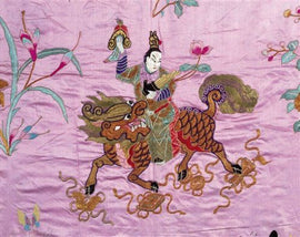 A vibrant jigsaw puzzle featuring an intricate depiction of a Chinese god riding a mythical creature adorned with embroidery. The background is soft pink, accentuated by floral motifs and swirling patterns, enhancing the artwork's cultural significance.