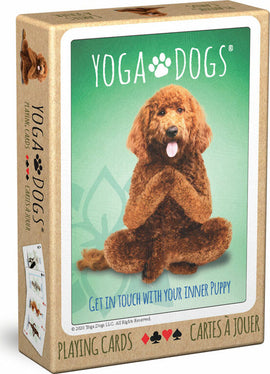 A box of 'Yoga Dogs Playing Cards' by Eurographics featuring a playful dog in a yoga pose on the front. The design includes a green background with the text 'GET IN TOUCH WITH YOUR INNER PUPPY'. The box showcases colorful card graphics, emphasizing a fun, playful theme.
