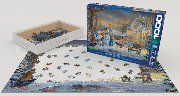 Eurographics Snow Creations jigsaw puzzle featuring a picturesque winter scene with snowmen and a cozy house. The box is open, showing scattered puzzle pieces on a partially completed image of the snowy landscape.