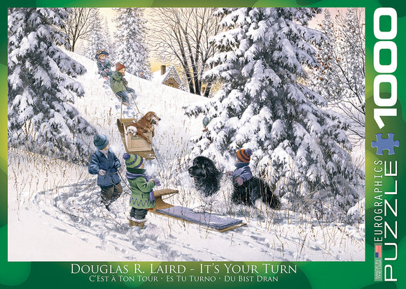 A 1000-piece jigsaw puzzle titled 'It's Your Turn' by Eurographics, depicting children playing in the snow with sleds and dogs. The artwork captures a winter scene with snowy trees and a cozy cabin in the background, evoking a sense of nostalgia and fun.