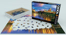 Eurographics jigsaw puzzle of Ottawa's Parliament Hill featuring 1000 pieces. The puzzle showcases a beautiful evening view of the Parliament buildings with reflections on the water.