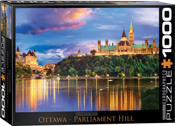 A 1000-piece jigsaw puzzle by Eurographics featuring a stunning view of Ottawa's Parliament Hill at sunset. The scene shows the iconic buildings reflected in the serene water, surrounded by lush greenery and a colorful sky filled with clouds.