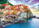 Beautiful jigsaw puzzle depicting the colorful hillside of Manarola, Italy, featuring vivid buildings perched on rocky cliffs above a serene ocean, perfect for puzzle enthusiasts.