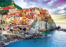 Beautiful jigsaw puzzle depicting the colorful hillside of Manarola, Italy, featuring vivid buildings perched on rocky cliffs above a serene ocean, perfect for puzzle enthusiasts.