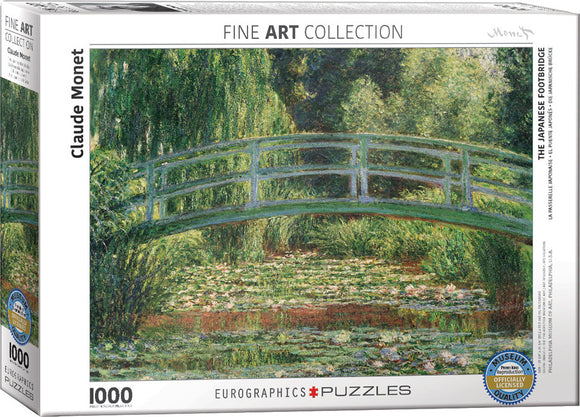 The Japanese Footbridge jigsaw puzzle by Claude Monet, produced by Eurographics. The box features a vibrant image of a serene footbridge over water, surrounded by lush greenery and water lilies, capturing Monet's impressionistic style. The puzzle consists of 1000 pieces and is part of the Fine Art Collection.