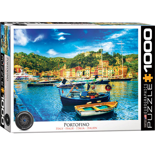 Eurographics jigsaw puzzle featuring a picturesque view of Portofino, Italy. The 1000-piece puzzle showcases colorful boats and vibrant waterfront buildings surrounded by lush hills, capturing the charm of the Italian Riviera.