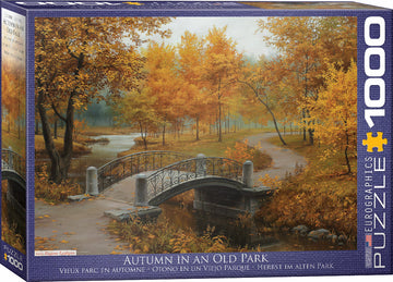 Eurographics jigsaw puzzle titled 'Autumn in an Old Park'. Features a serene landscape of a park in autumn with vibrant orange and yellow leaves, a picturesque bridge, and a gently flowing river. The box has a beautiful illustration capturing the essence of fall in an old park, ideal for puzzle enthusiasts and autumn lovers.