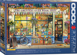 A beautifully illustrated jigsaw puzzle featuring 'The Greatest Ever Book Shop.' The design showcases a colorful bookstore window adorned with flowers, various books, and a bicycle outside. The storefront is inviting, with books lining the shelves and a welcoming ambiance created by hanging decorations and warm lighting. Perfect for book lovers and puzzle enthusiasts alike, this 1000-piece puzzle captures the charm of a bustling bookstore.