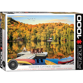 Eurographics jigsaw puzzle featuring a serene lakeside cottage setting in Quebec. The image showcases vibrant fall foliage reflecting in calm waters, with a wooden dock and colorful kayaks in the foreground, creating a peaceful and picturesque outdoor scene.